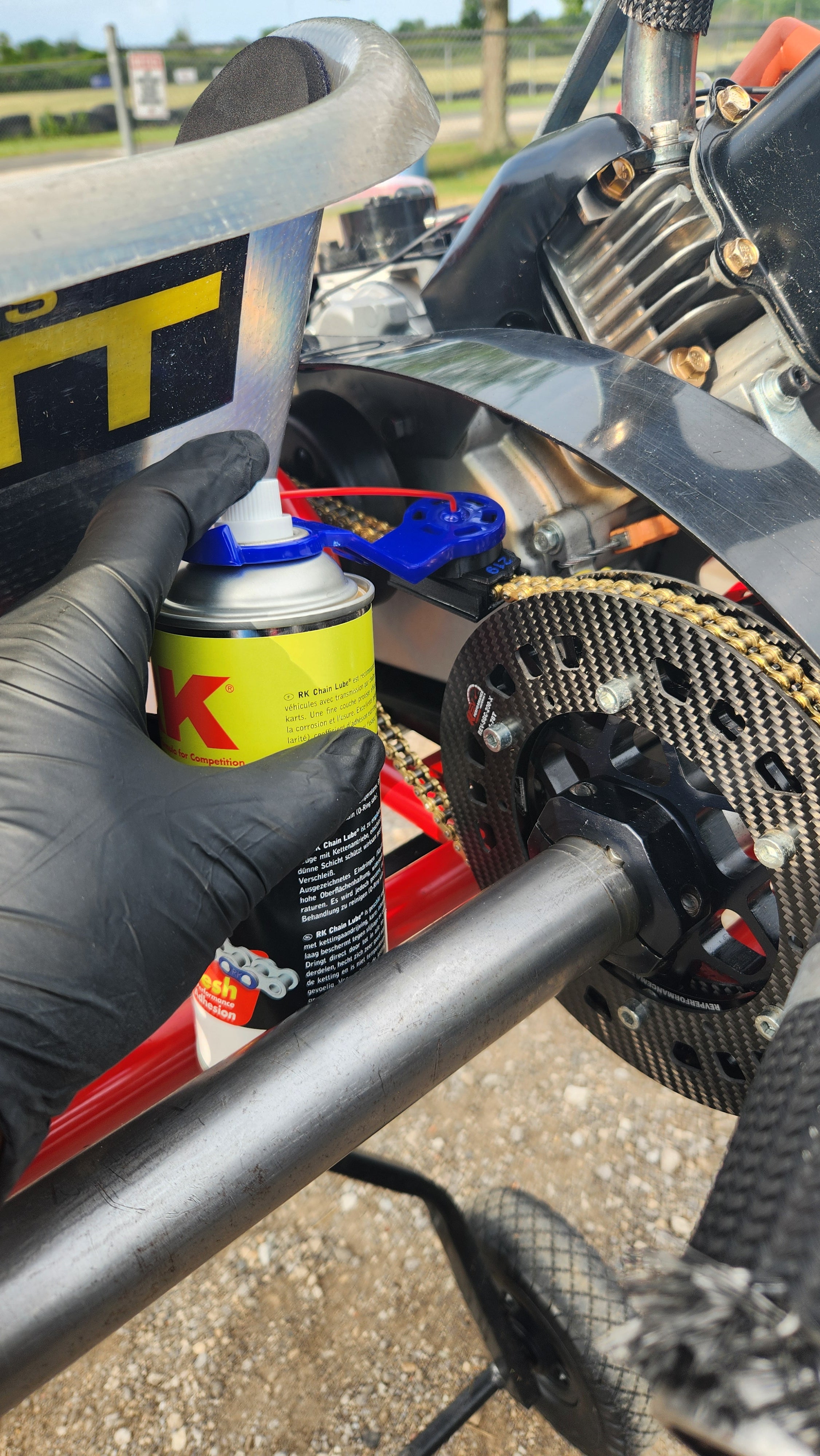 Oinker go kart chain oiler attached to aerosol spray can