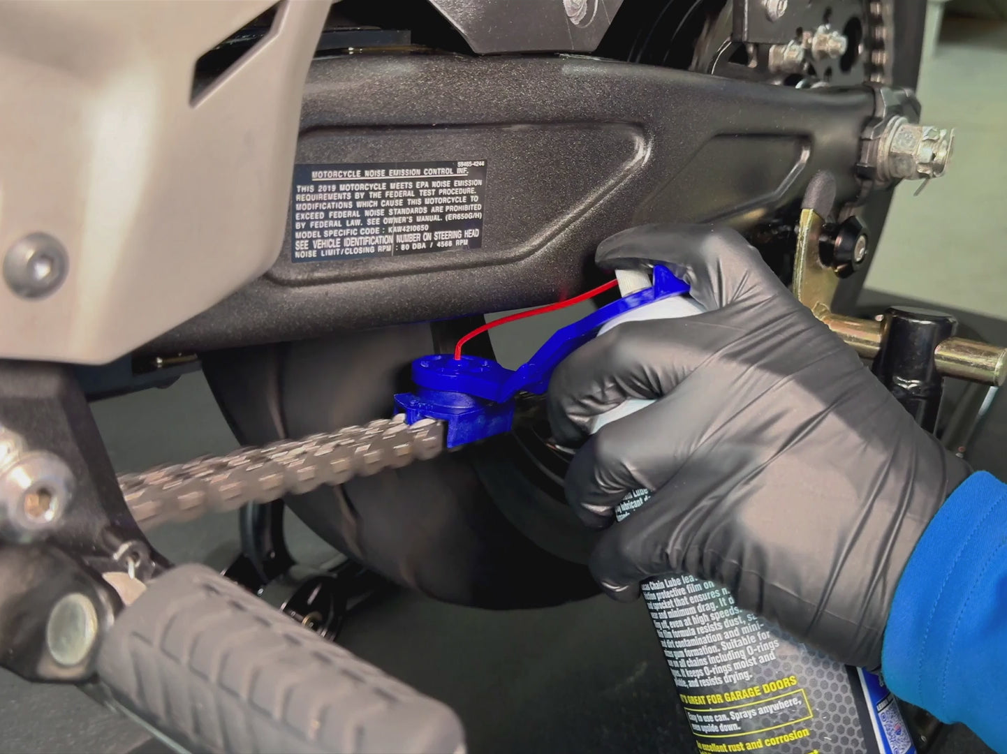 Load video: Oinker tool applying chain lube directly to motorcycle chain