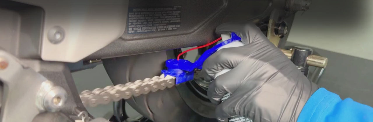 Load video: Oinker Motorcycle Chain OIler bveing use on motorcycle to lube chain